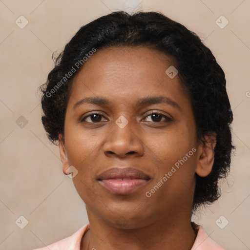 Joyful black adult female with short  brown hair and brown eyes