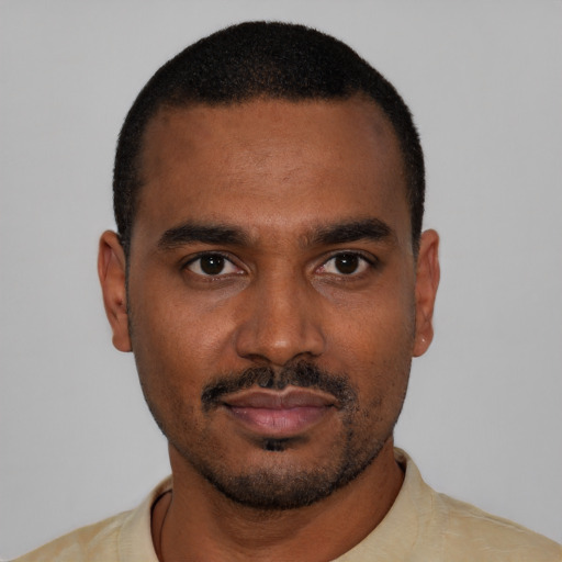 Neutral black young-adult male with short  black hair and brown eyes