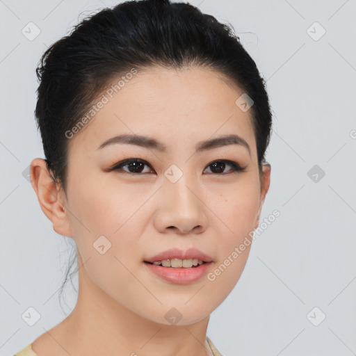 Joyful asian young-adult female with short  brown hair and brown eyes