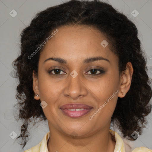 Joyful latino adult female with medium  brown hair and brown eyes