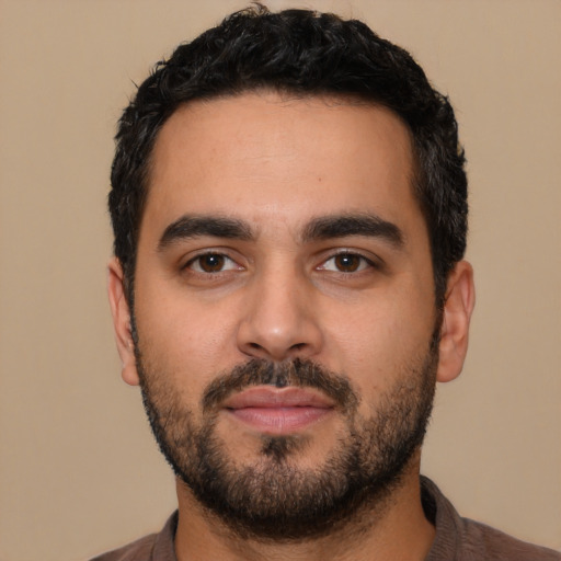 Neutral latino young-adult male with short  black hair and brown eyes