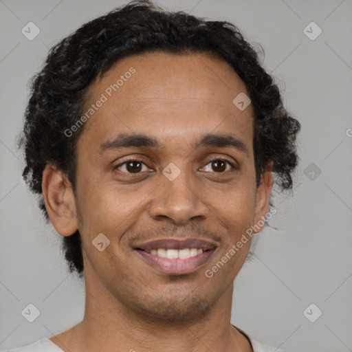 Joyful black young-adult male with short  brown hair and brown eyes