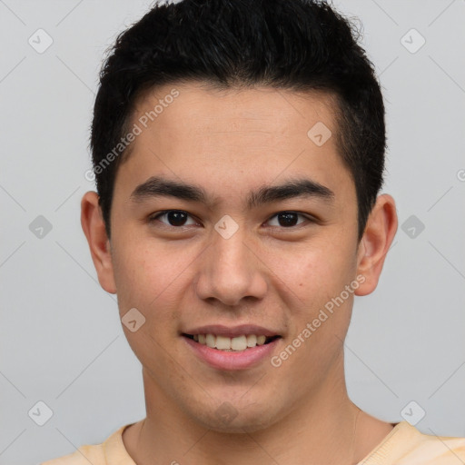 Joyful latino young-adult male with short  brown hair and brown eyes