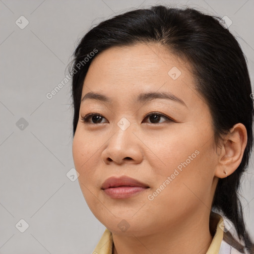 Joyful asian young-adult female with medium  brown hair and brown eyes