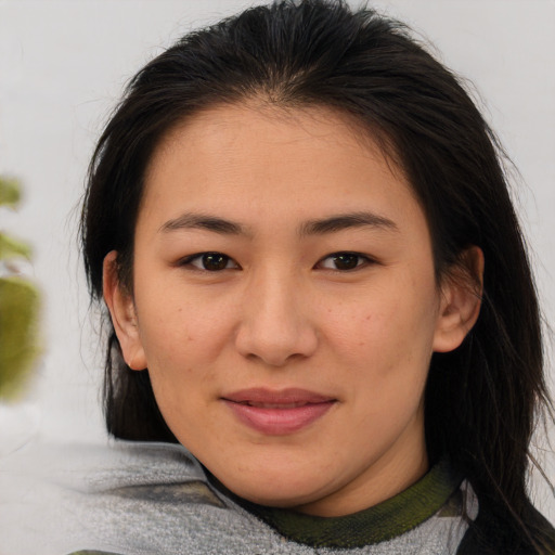 Joyful asian young-adult female with medium  brown hair and brown eyes