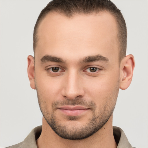 Joyful white young-adult male with short  brown hair and brown eyes