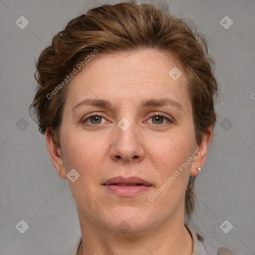 Joyful white adult female with short  brown hair and grey eyes