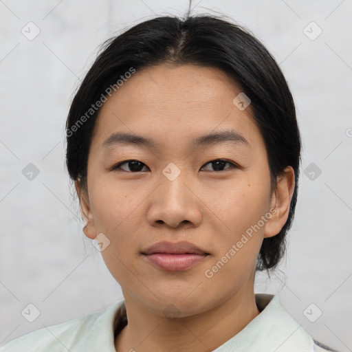 Joyful asian young-adult female with short  brown hair and brown eyes