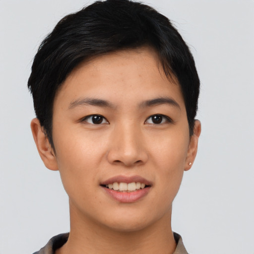 Joyful asian young-adult female with short  brown hair and brown eyes