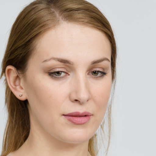 Joyful white young-adult female with long  brown hair and blue eyes