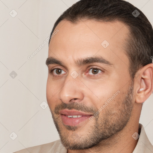 Joyful white young-adult male with short  brown hair and brown eyes