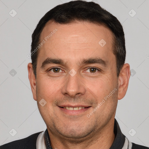 Joyful white adult male with short  brown hair and brown eyes