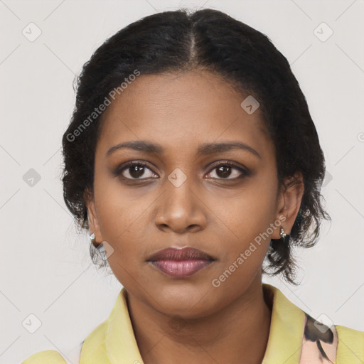 Joyful black young-adult female with short  black hair and brown eyes