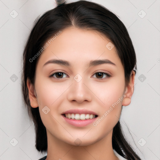 Joyful white young-adult female with long  black hair and brown eyes