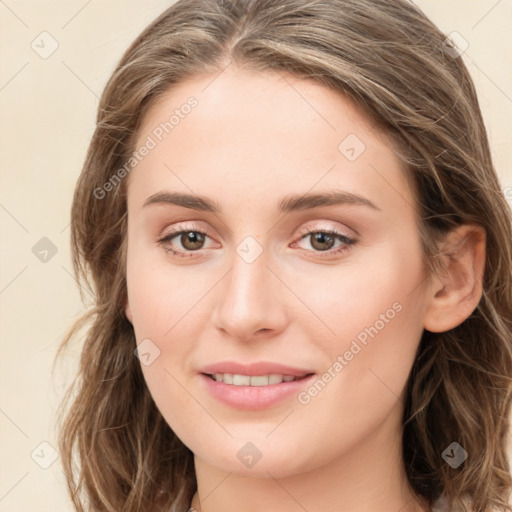 Joyful white young-adult female with long  brown hair and green eyes