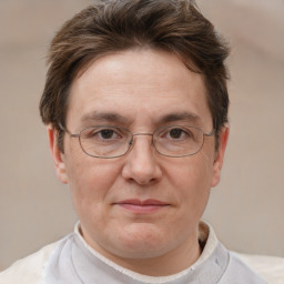 Joyful white adult male with short  brown hair and grey eyes