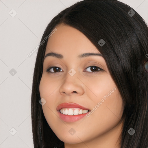 Joyful white young-adult female with long  black hair and brown eyes