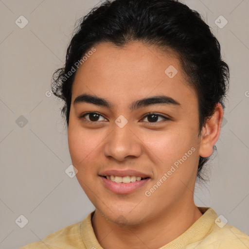 Joyful latino young-adult female with short  brown hair and brown eyes