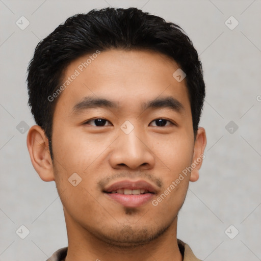 Joyful asian young-adult male with short  black hair and brown eyes