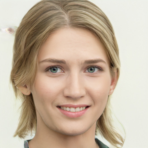 Joyful white young-adult female with medium  brown hair and green eyes