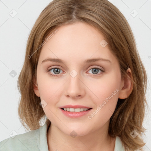 Joyful white young-adult female with medium  brown hair and blue eyes