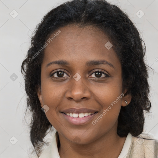 Joyful black young-adult female with long  brown hair and brown eyes