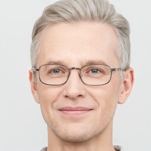 Joyful white adult male with short  gray hair and grey eyes