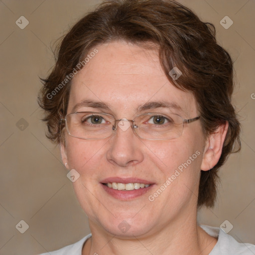 Joyful white adult female with medium  brown hair and blue eyes