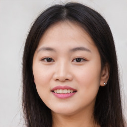 Joyful asian young-adult female with long  brown hair and brown eyes