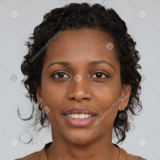 Joyful black young-adult female with medium  brown hair and brown eyes