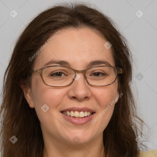 Joyful white adult female with long  brown hair and green eyes