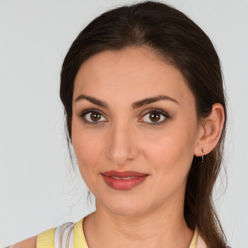Joyful white young-adult female with medium  brown hair and brown eyes