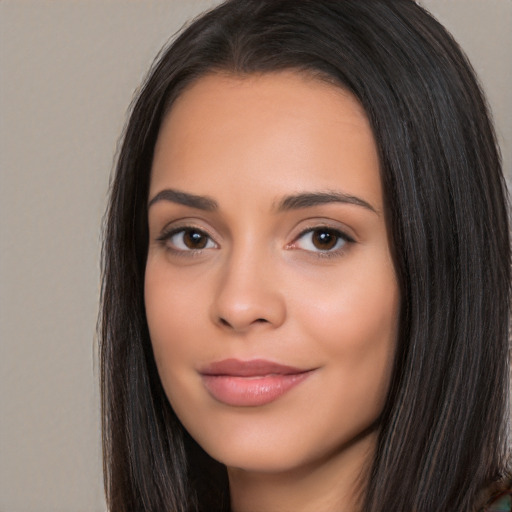 Joyful white young-adult female with long  black hair and brown eyes