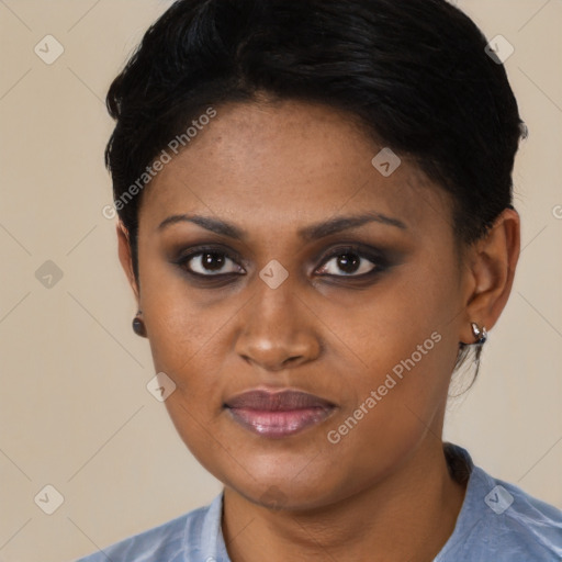 Joyful black young-adult female with short  brown hair and brown eyes