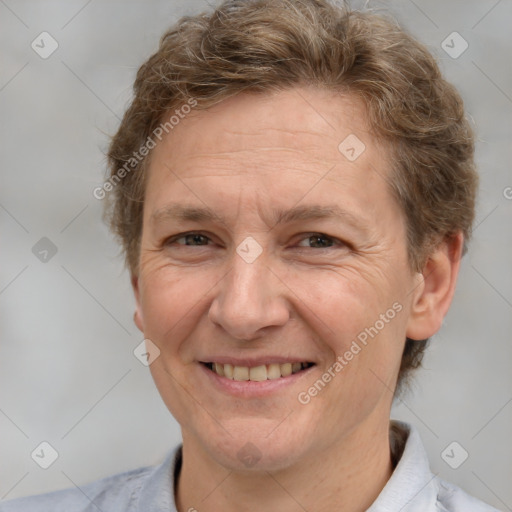 Joyful white adult female with short  brown hair and brown eyes