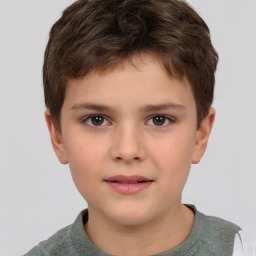 Joyful white child male with short  brown hair and brown eyes