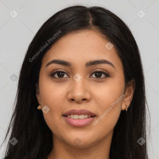 Joyful latino young-adult female with long  brown hair and brown eyes