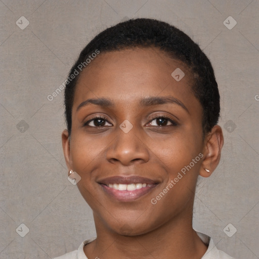 Joyful black young-adult female with short  brown hair and brown eyes