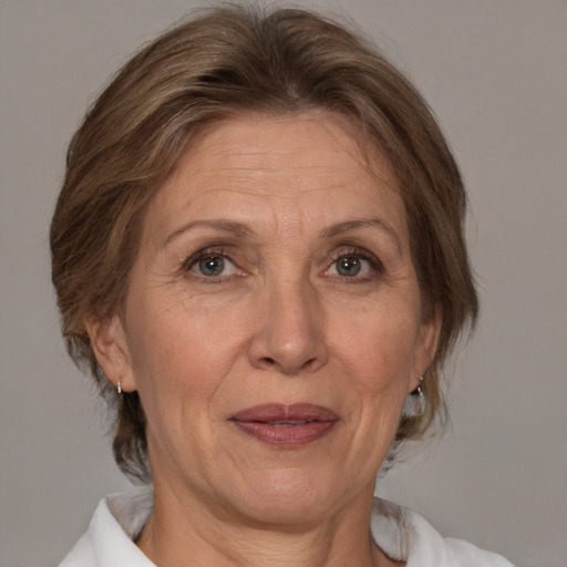 Joyful white middle-aged female with medium  brown hair and brown eyes