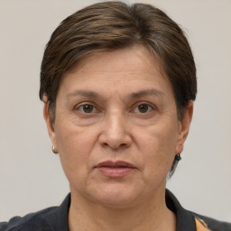 Joyful white adult female with short  brown hair and brown eyes