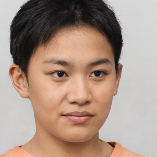 Joyful asian young-adult female with short  brown hair and brown eyes