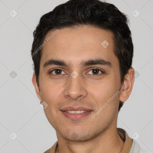 Joyful white young-adult male with short  black hair and brown eyes