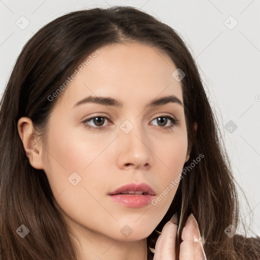 Neutral white young-adult female with long  brown hair and brown eyes