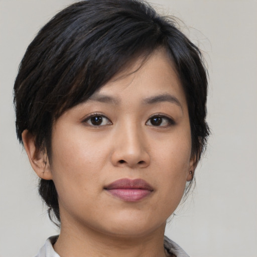 Neutral asian young-adult female with medium  brown hair and brown eyes