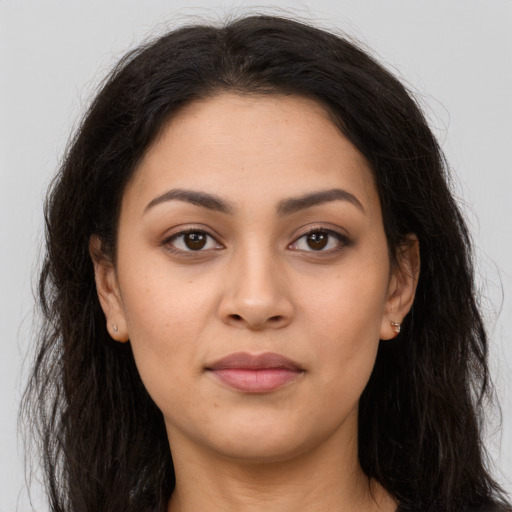 Neutral latino young-adult female with long  brown hair and brown eyes