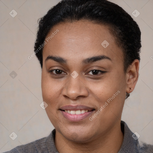 Joyful black young-adult female with short  brown hair and brown eyes