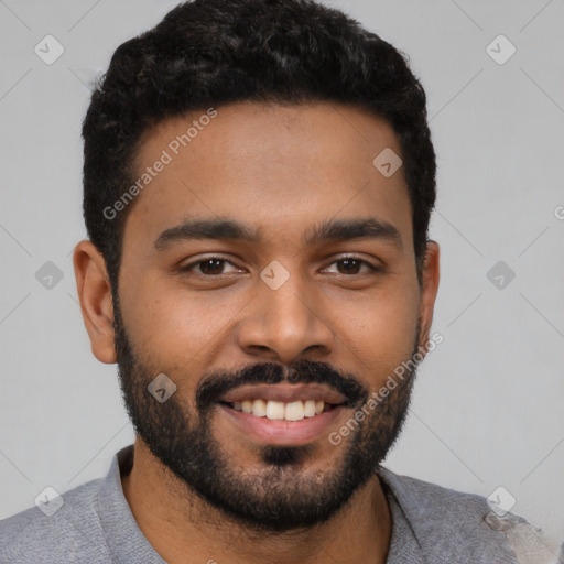 Joyful black young-adult male with short  black hair and brown eyes