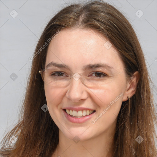 Joyful white adult female with long  brown hair and brown eyes