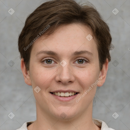 Joyful white young-adult female with short  brown hair and grey eyes