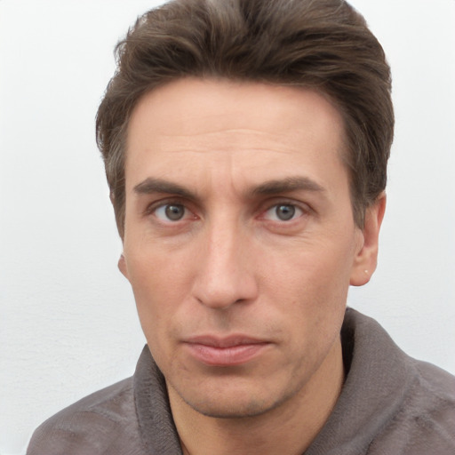 Neutral white adult male with short  brown hair and grey eyes